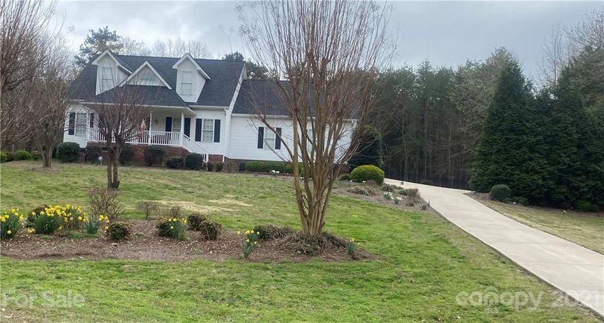 2.91AC Lot and Home located in the High Rock Lake subdivision of Waters Edge.Main level features living room w/gas log fireplace, dining/breakfast area,bar area,kitchen,laundry,granite countertops,large pantry,master suite which includes 2 vanities, soaker tub,walkin shower and large walk in closet.Main level has a 2 car attached garage.Upstairs has 2 bedrooms and a full bath with granite countertop.Large covered deck off of kitchen and dining with builtins and fans for you to enjoy, perfect for entertaining or privacy and nature,as well as a large fenced in area.The back part of the lot has a 50'x50' building w/2 tall garage access doors.  Inside has a car lift and an area that can be sectioned off for a paint/body room,every man's dream,or just use to store all your toys/RV.  Professional photos and measurements coming soon.Location is everything,5 min. to I-85,40 min. to Greensboro/Winston Salem,1 hour to Charlotte airport.Schedule your showing today,don't miss out on this property.