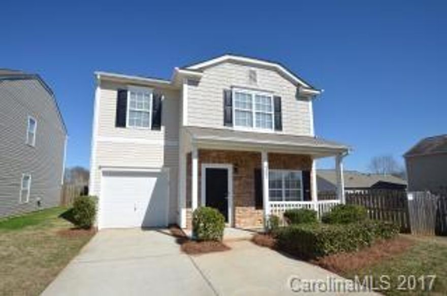 You'll make long-lasting memories in this home. This house features all-white kitchen appliances that are complimented by the bright wood cabinetry. There is a dual-sink vanity in the master bathroom as well as a garden tub. The fireplace adds a touch of coziness to the living room and there is fresh carpeting throughout the space.