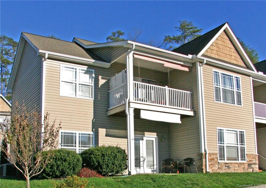 Great location!  Less than 10 minutes from downtown Asheville, this small condominium complex is peaceful & quiet.  Lower level unit perfect for low-maintenance residence or second home.  Open floor plan for entertaining, electric fireplace in living room, French doors to covered porch for outdoor living.  Split bedroom plan, each with walk-in closet and its own bath.  Separate laundry room & pantry.  All major appliances convey!