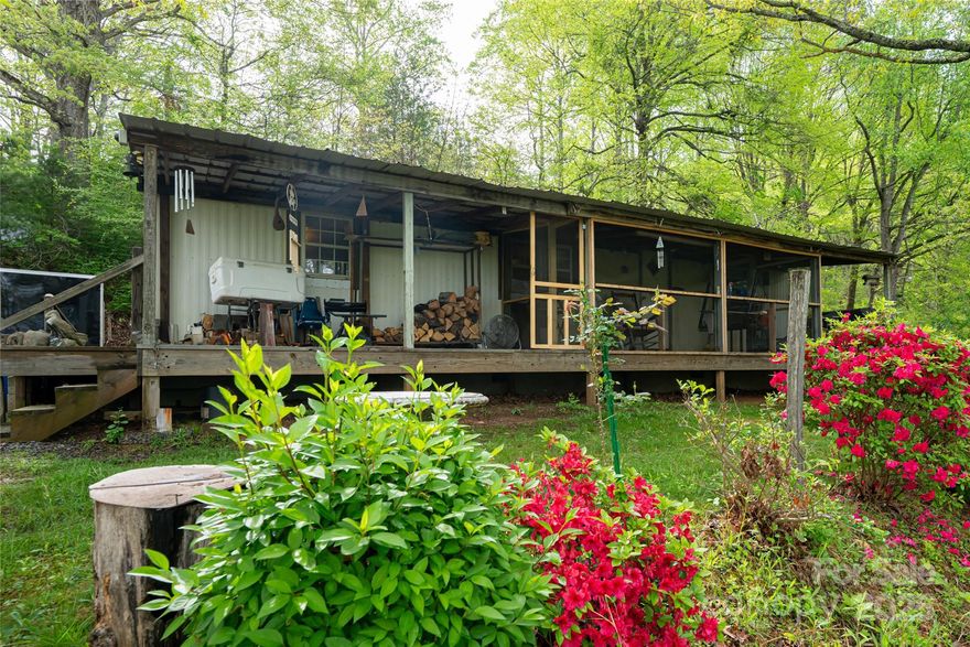 Come enjoy layered, long range mountain views from the porch surrounded by nature, yet tucked away in privacy.  This property has a lot to offer with many option, rehab or rebuild with a garden spot, workshop, canning shed and flowering landscaping.  This unique property is worth checking out.