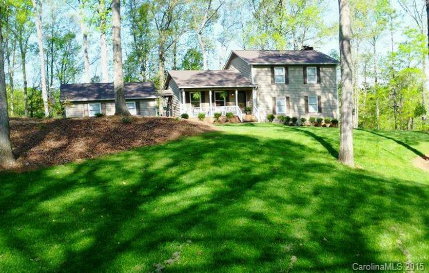 Beautiful home nestled on a beautifully landscaped lot in an established neighborhood. Formal Dining, gorgeous kitchen with solid wood cabinetry and bay window. Large deck for entertaining, country front porch, storage building. Oversized Garage with workshop area connected by breezeway. Turn Key ready! Close to I-77, Restaurants and shopping. Qualifies for USDA financing.