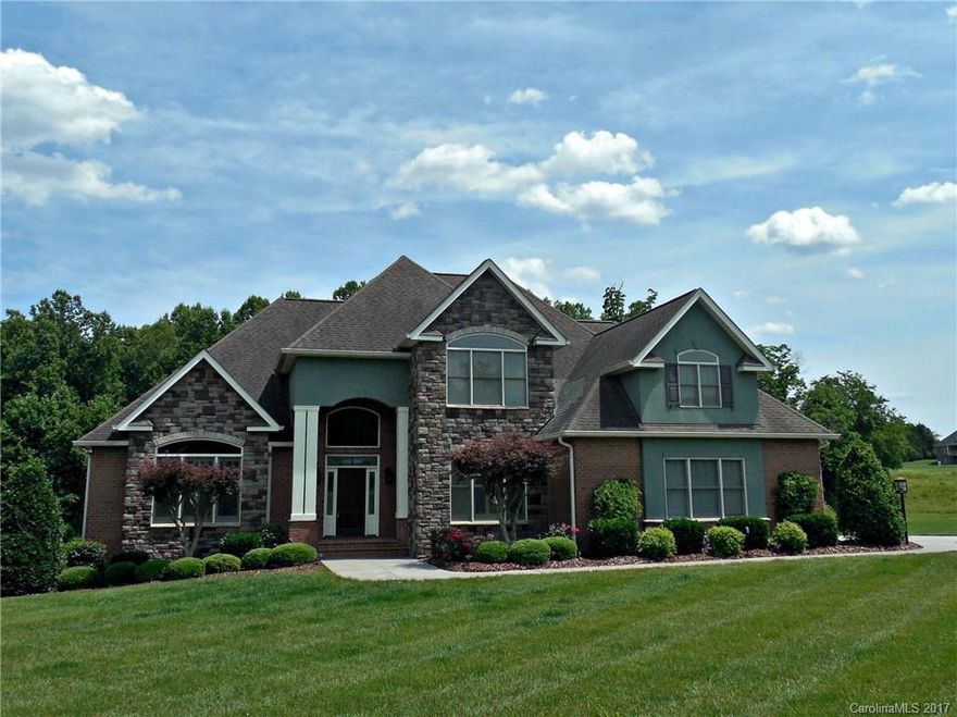 Truly stunning home, meticulously & lovingly cared for! Gorgeous entry leads to vaulted living room with glowing hardwood floors. Chef's kitchen w/ breakfast area. 2 surround sound systems. Relax on the screened deck, in one of TWO upstairs bonus rooms, in the elegant bar, or in the media room! Manicured lawn, 1.5+ acres, and no HOA! Current storage room is wired/plumbed for 2nd kitchen in basement, and laundry hookups located on main & basement. 2 car garage and storage room for outdoor equip.