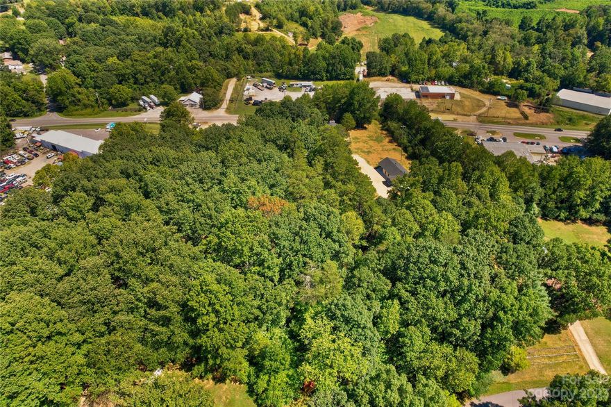 Seller has applied for rezoning from B-5 to Residential Zoning. 1.97 Acre buildable lot prime for development. Just north of Troutman and Barium Springs & South of Statesville. 
Lot is also listed with two homes for a total of 3.51 acres of land. This is a must see. Reference MLS#4065611,4065612 and MLS # 4066240. Seller nor agent know of any building restrictions or if lot can be divided. Please call Statesville planning and zoning for further information. There is a deeded easement for this property.