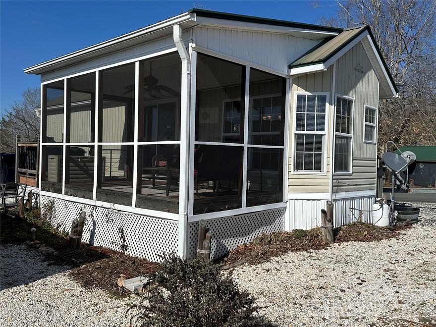 Enjoy stunning long-range views of Badin Lake from this furnished 1-bedroom park model, complete with a screen porch perfect for relaxing or entertaining. Whether you're preparing meals in the kitchen or dining inside, you'll always have a front-row seat to the lake's beauty. This property offers abundant parking—room for your boat and several vehicles—making it ideal for weekend getaways or full-time lake living. Located in the gated, waterfront community of Badin Shores Resort, you'll have access to a wide range of amenities including a waterfront boardwalk, clubhouse, putt-putt, basketball courts, playgrounds, fishing pier, sandy beach, and lake swim area. Perfect for those seeking a low-maintenance lifestyle with plenty of recreational opportunities, this home is your ticket to lake life at its best. Whether you're looking for a peaceful retreat or an active community, this property has it all. Don’t miss your chance to own a slice of paradise!