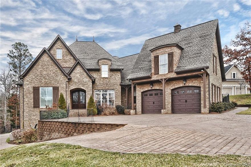 Exquisite executive home on Lake Wylie. Immaculately maintained with all the extras. Soaring 2-story great room. Large master suite on main with sitting area. Chefs dream kitchen with 5-burner gas cook top and double ovens. Two BR's on 2nd with private baths. Dream basement features media room with tiered seating and projection screen, billiard area, wet bar, wine cellar, 2 additional BR's, 2 baths and laundry. InGround pool hot tub, full kitchen, FP, covered patio, putting green.