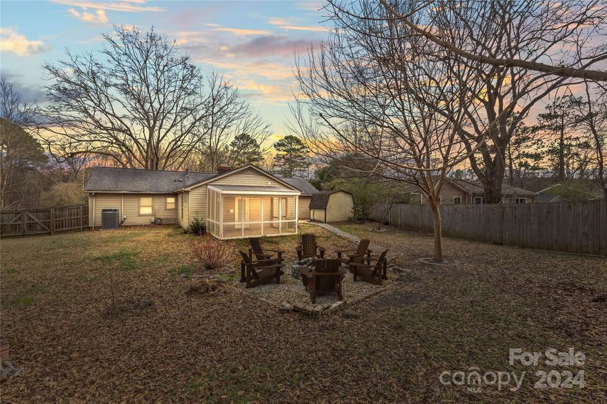 Great opportunity in Falconbridge! This cozy ranch with 1-car garage features 3 bedrooms, 3 full bathrooms, spacious living room, eat-in kitchen, large den with custom built-ins, separate laundry room, and great storage space throughout! So many great improvements done including newer laminate wood flooring, 2018 Trane HVAC w/ Air purifier added in 2020, custom window treatments, crown molding, newly updated bathroom, granite counters, stone backsplash, painted cabinets and a large pantry. Enjoy the screened-in porch overlooking the private, fenced-in backyard w/ gravel walkway to the cozy firepit area and storage shed! Large 1-car garage w/ extra storage space, an additional parking pad and gravel parking area that is perfect for parking a boat/trailer/camper. No HOA and endless possibilities! Beautiful, established neighborhood with access to McMullen Creek Greenway. Excellent location!!