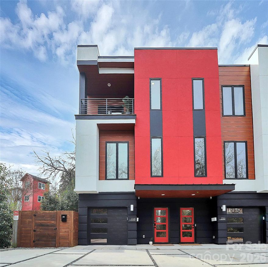 LUX Noda is a private enclave of artistically designed townhomes right in the pedestrian district of NoDa!  These exclusive homes are not your typical box on top of a box track home design, they truly exude charm and opulence.  Everything was tastefully designed, from the permeable driveway to the artful designed exteriors.   This END unit gets lots of natural light all throughout.  The lower level features a large garage (extra reserved parking is also in front!) and a featured hallway leading to the guest suite with private bath, murphy bed and access to the backyard.  As you walk up the stairwell you arrive at the main level where there is a large living room with electric fireplace and designer wall coverings.  The large cook's kitchen is the perfect place to gather with friends.  Highlights include the induction cook top, custom backsplash, oversized island and plenty of cabinet space. As you head up the open stairwell, you see where this home truly shines.  The primary bedroom is perched in the tree tops and feels like a luxury penthouse in the sky.  The large bedroom features two closets and a private balcony!  The luxurious bathroom has tall ceilings, lots of light and wet room complete with shower and tub.  The skylight lets in all the natural light from above!   All of this and so much more in the best part of Charlotte.  Hang out where the best bars, restaurants, boutiques and more are centered.  Hop on the light rail or go two blocks to the Y for a workout!  Low HOA dues. Take a look today!