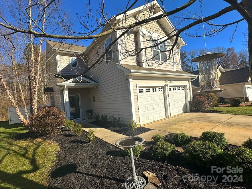 Beautiful two story home in desirable Whitley Mills subdivision. Conveniently located near shopping and restaurants but still feels private and tucked away in this serene and quiet community. Enjoy summer months at the neighborhood's beach-entry pool and newly renovated clubhouse. Located in Fort Mill's sought after and award-winning school district. This newly listed 3 bedroom, 2.5 bath feels airy and spacious with 9ft ceilings and an open concept living space. Home has numerous upgrades beginning with a decorative stone-surround fireplace, modern fixtures, subway tile backsplash, granite counter tops and hardwood floors throughout the main. Master boasts his and hers large walk in closets, garden tub, and vaulted ceilings. Laundry conveniently located upstairs. Enjoy peaceful and fully fenced in back yard with a wooded view and built in fire pit for cool evenings. Comfortable patio space perfect for entertaining.