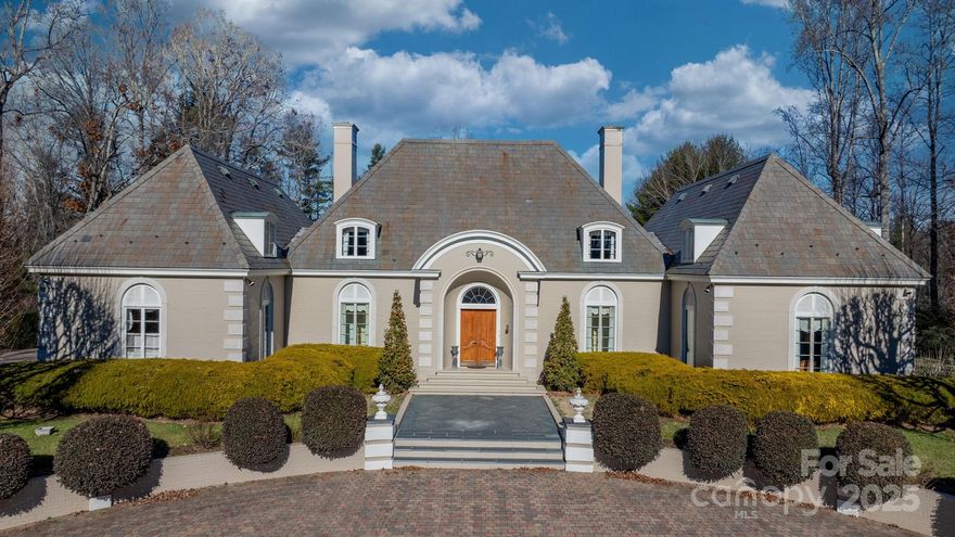 Built in 1966, this 7,324 SF Neo-French estate sits on 11.42 acres in the foothills of Western NC. An entertainers’ dream,this property provides rich detail, large windows & high ceilings giving rooms perfect proportion that enhance the sense of space & elegance. Main level: 2 primary BR, office/library, family room, kitchen, laundry & lrg living/dining entertainment space that opens via a series of French doors to the expansive bluestone patio that overlooks a large fountain & pergola that beautifully frames the outdoor living space. 2nd flr: 3 add’l primary BR, playroom, spacious billiards/ent rm w/stage, FP, wet bar & dumbwaiter that runs from the main level make it an ideal space for leisure and entertainment. With 5 BR/5½ BA, this home has plenty of space to inspire and pamper you while providing easy access to Blowing Rock,Boone,Blue Ridge PW and just over an hour’s drive to CLT Airport. Whether a private residence or luxury retreat, this is a rare gem waiting to be rediscovered.