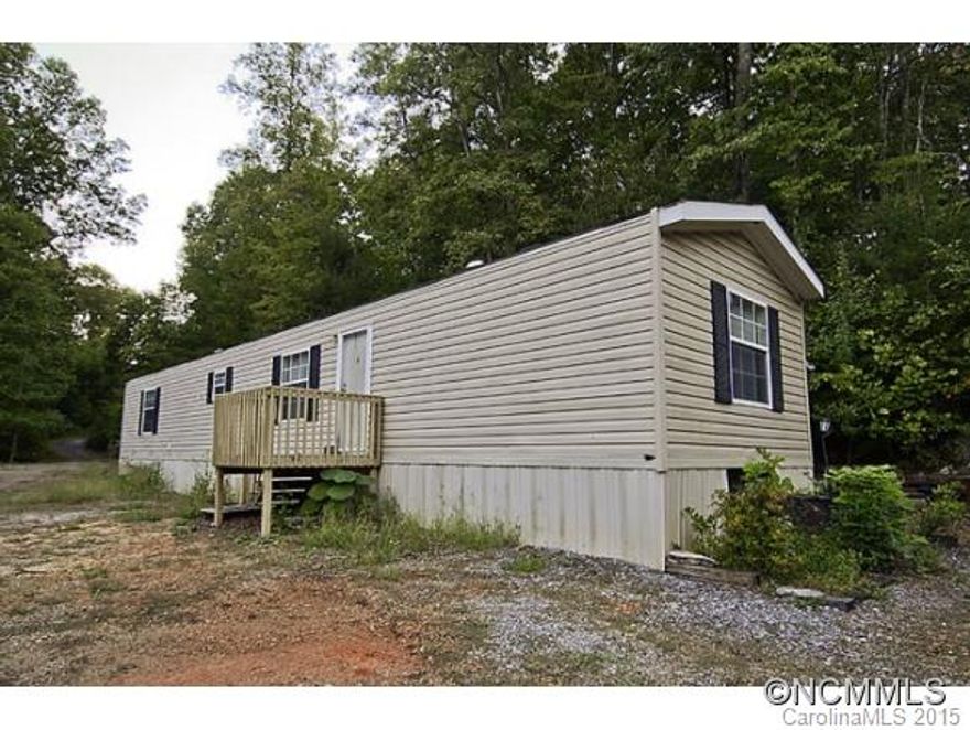 2007 Horton 2 bedroom / 1 bath single wide manufactured home. This is a very private location and has many possibilities. There are a couple out buildings for storage, carport, and a covered rear deck. 9.7 unrestricted acres! Minutes from I-40!