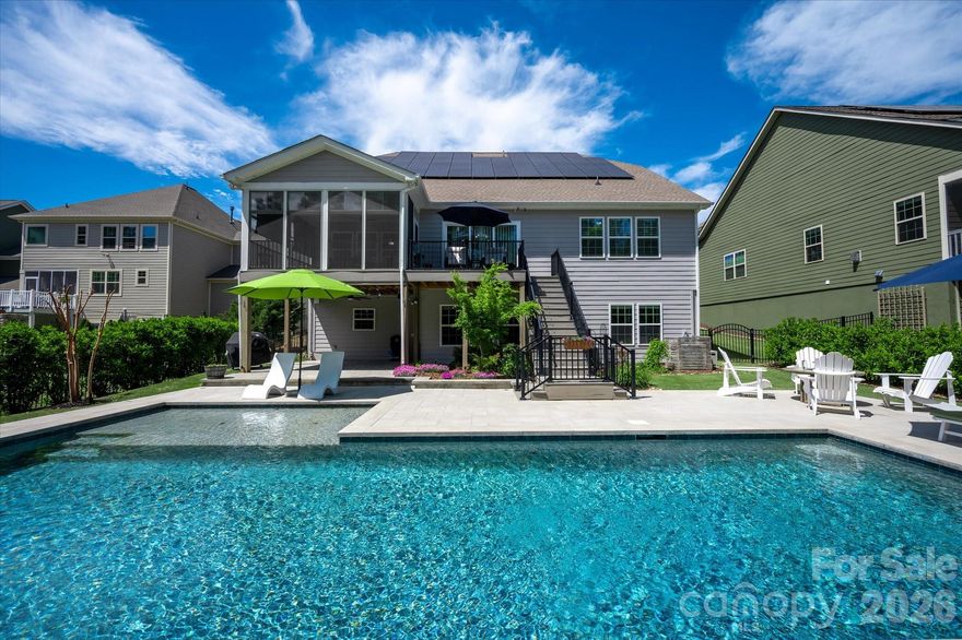 A truly exceptional Basement home in a wonderful SC community just south of Ballantyne. From the Energy efficiency to the gorgeous pool.... this one is impressive!  Designed to exceed the expectations of even the most discerning buyers.  Newer pool with heater and chiller...keeps you cool in the HOT Summer and Warm in the fall.
This home is equipped with advanced energy solutions, including solar panels paired with two Tesla Powerwall, maximizing energy efficiency by storing excess solar power for use during non-daylight hours.  Monitoring is made easy with the Tesla and Sun Energy apps, providing real-time insights into energy usage. Additional features include a 220V car charger-ready outlet in the garage, a SPAN fuse box for detailed energy management and circuit control via a smartphone app, and a robust 200A electrical capacity to support simultaneous operation of all appliances, HVAC units, and car charging needs.
Custom porch including easy breeze windows and high btu heater allowing year-round enjoyment. Sprinkler system was added in 2020.  Expansive patio around the pool, too.
Beautiful White Kitchen with gas cooktop, built in ovens and huge island that opens to the family room with Gas fireplace.  Stereo speakers in the kitchen, living room, patio, pool, and deck!!
Crown molding, custom built-ins in Family Room, Office, primary bedroom closet, and in multiple spaces in the basement. 
Basement is fully finished with kitchen, bedroom, flex space w/ Murphy BED, full bathroom, and tons of storage.  Also, private entrance from side of home with paver walkway. This finished basement has newer HVAC unit and the downstairs electrical is on a sub-panel.  This could be more easily configured into a separate meter for the downstairs if you wanted.
Fenced Yard and Wooded lot! I can go on....  Wi-fi hub located under deck in patio area that allows full internet connection around pool...Three car garage w/ epoxy floors.... Five CAT - wired televisions...SWAN security Cameras...Central VAC....Tankless Water Heater!