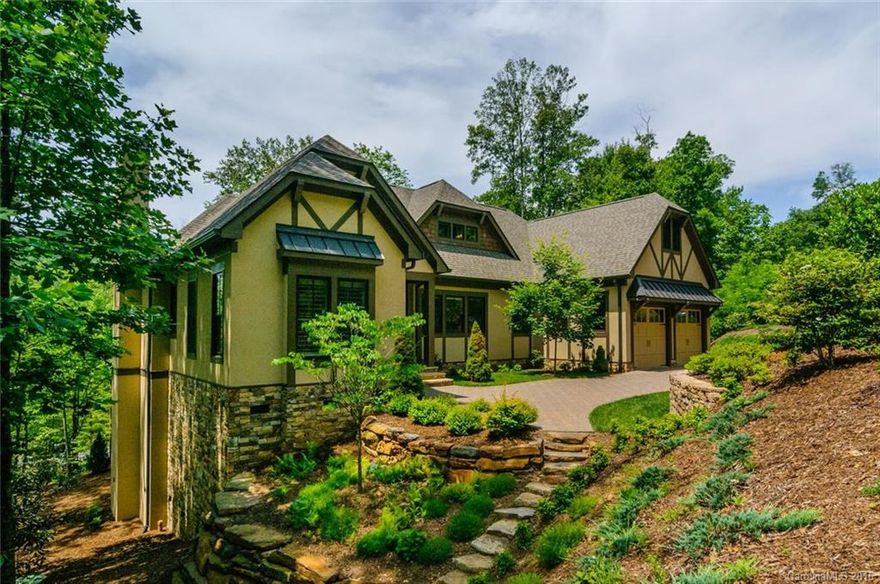 Open Floor plan with top end finishes. Vaulted and 10 ft ceilings.Plantation shutters, travertine, hardwood, granite, and marble throughout. Radiant floor heating in master bath.  Amazing chef's open kitchen. Large estate lot in gated community close to Asheville. Lovely mountain home with over 2200 SF of living on the main level. Walking distance to trails and playground. One of a kind mountain home.