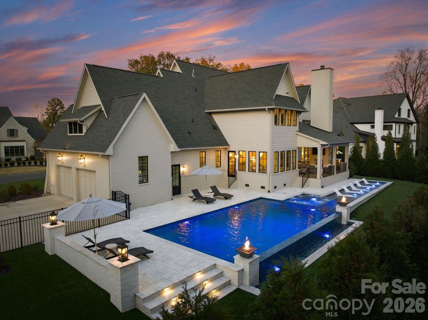 Welcome to an extraordinary modern estate, completed in 2023, in the heart of Myers Park, where refined architecture and modern elegance converge. A grand, light-filled interior unfolds through an expansive open floor plan, anchored by a main-level primary suite and private guest retreat, each designed with a sense of quiet luxury. The primary sanctuary is complemented by a spa-caliber bath, featuring a sculptural soaking tub, marble walk-in shower, dual vanities, and an impeccably designed bespoke dressing room.
The culinary space is both striking and functional, centered around a statement white oak island with luminous quartz surfaces and appointed with a suite of professional-grade appliances by Thermador, Wolf, and Sub-Zero. White oak floors extend throughout, while soaring vaulted and coffered ceilings, tailored millwork, and curated designer lighting create a layered and sophisticated aesthetic. Walls of glass invite abundant natural light, enhancing the home’s seamless flow and sense of scale. Upstairs, four beautifully appointed bedrooms are complemented by a private study, media lounge, and a flexible fitness or wellness space. Designed for elevated living and effortless entertaining, the covered outdoor terrace features a built in grill, beverage refrigerator, ice maker, fireplace, and integrated heating for year-round enjoyment. The grounds have been transformed with animal friendly turf, a 90-foot in-ground heated saltwater, Pebble Tec, Infinity edge swimming pool, surrounded by sandblasted textured marble and exquisite fire bowls adding a touch of elegance. Home equipped with a WHOLE HOUSE GENERATOR and fully integrated with a Control4 smart home system, offering a seamless and intuitive living experience. Welcome Home!  Please see attached features for complete list of extraordinary details!