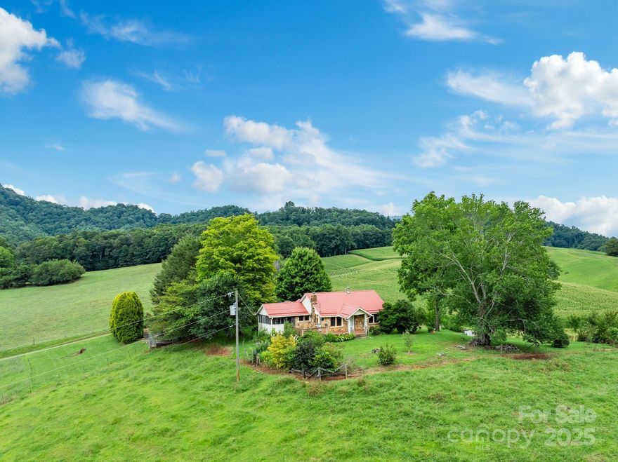Mini Farm and organic gardens...come take a look at this cozy 2-bedroom, 1-bath cottage nestled on 1.95 acres of gently rolling land. This home blends warmth and functionality, featuring a living room w/ a wood stove fireplace for those crisp mountain evenings, and a country kitchen that frames sweeping views of the surrounding Newfound Community.
Outdoors, you’ll find multiple outbuildings for storage or hobbies, established gardens, and space perfect for play or relaxation. The property borders Brooks Branch and includes a pasture area ideal for a horse, goats, or other livestock. Whether you’re seeking a mini-homestead, farm, mountain getaway, or a place to slow down & savor country living, this property delivers the best of both worlds — privacy and pastoral beauty, all within a short drive to Asheville. 
RATE BUYDOWN AVAILABLE!
Great location in the country, while convenient to town-10 miles to Patton Ave & 7 miles to I-40.
This property was previously used for dog breeding/kenneling & could be restored. 
Shown by appointment only.
