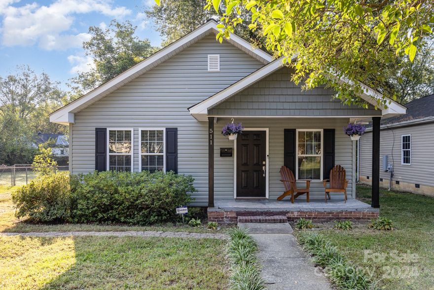 Welcome home to this charming bungalow located on a large level lot surrounded by mature trees.  Located in the heart of Rock Hill, you will have quick access to all the amenities the city has to offer.  The moment you walk in you will be greeted by this open concept floor plan boasting granite countertops, stainless steel appliances, and upgraded cabinetry. New LVP flooring (2024) runs throughout the home as well as a new architectural shingled roof installed 2024.  ASSUMABLE FHA LOAN at 3.5% for those who qualify! Don't let this opportunity pass you by!