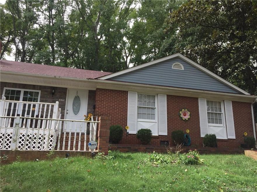 Brick and stone detail ranch with three bedrooms and two full baths has many charming details...hardwood floors, woodburning fireplace, small octagonal windows in the formal living room and also a sunken den off the kitchen for a second hang out spot in this adorable home.  Exit sliding doors to the patio and enjoy the outdoor fireplace in the privacy fenced backyard.  Driveway can accommodate three cars. Close to major freeways, shopping, amenities, minutes from uptown.