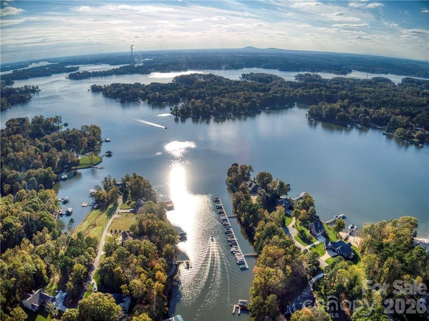 Tucked away on a private cul-de-sac in the highly sought-after waterfront community of Beacon Pointe, this exceptional waterfront lot offers the Lake Norman lifestyle buyers dream about. With your own dock already in place, you can begin enjoying the water while planning and building your custom home. Surrounded by mature trees, luxury homes, and peaceful lake views, this property delivers rare privacy and tranquility—yet remains incredibly convenient. A charming neighborhood path leads to the water, enhancing the natural beauty and serene setting that makes this community so special. Bring your own builder and create the home you’ve always envisioned. Waterfront lots in this area are becoming increasingly scarce, making this a rare find. Located just 1.5–2 miles off Perth Road, you’ll enjoy the perfect balance of quiet country living and everyday convenience. Shopping, dining, and local schools are all within a 10-minute drive, and Lake Norman State Park is just minutes away. Ideally positioned between Mooresville and Troutman, this location offers flexibility and accessibility without sacrificing peace and privacy. This is more than just a homesite—it’s your chance to build on the water in a beautiful Lake Norman community. Come walk the lot and experience the setting in person. You won’t want to leave.
