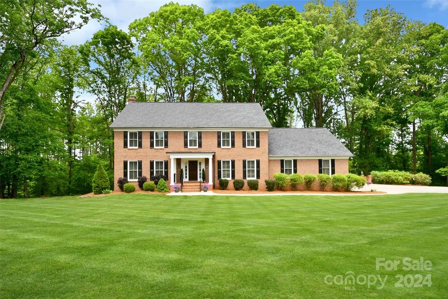 Nestled just moments away from the charming downtown area, this stunning custom-built home epitomizes luxury living at its finest. A grand entry welcomes you with elegance. Spanning an expansive square footage, this residence offers an abundance of space for both relaxation and entertainment. The spacious bedrooms provide a tranquil retreat, each exuding its own unique character. For the wine enthusiast, a beautifully appointed wine cellar awaits. Meanwhile, the basement presents an exceptional opportunity for hosting gatherings and creating memories with friends and family. Step outside onto the beautiful deck, where you'll be greeted by breathtaking views of the meticulously landscaped grounds, adorned with mature trees and accentuated by a tranquil water feature. The three-car garage provides ample parking as well as a huge walk-in attic offering endless possibilities for storage. You do not want to miss your chance to make this exquisite property yours.