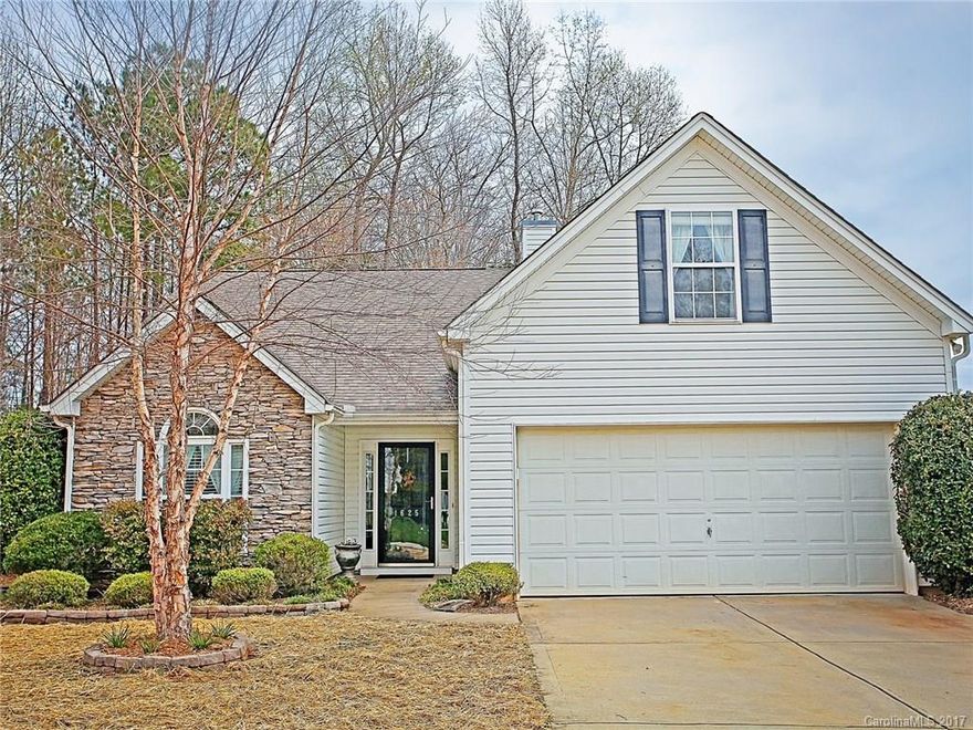 Fabulous Stone Accented RANCH with a WONDERFUL Private Fenced Back Yard! Back Covered Porch with extended Patio surrounded by a natural area with shade trees and backs to woods. Open floor plan with inviting foyer with sidelights, wainscoting and arched door way. Vaulted Great Room with fireplace. Large Master with private bath, garden tub, shower, double sinks and vanity. Versatile Bonus Room! Set in Amenity Rich Neighborhood with pool, tennis, club house, rec area, and pond. Must see this one!