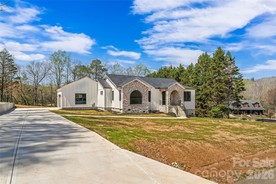 Imagine country living with city convenience—just 15 minutes to downtown Hickory. This stunning new-construction modern home offers bright, open-concept living with vaulted ceilings, wide vinyl-plank flooring, and oversized windows that flood every room with natural light. The chef’s kitchen features a large island, quartz countertops, stainless appliances, and a walk-in pantry, flowing seamlessly into the living area and out to a rear porch—perfect for indoor-outdoor entertaining. Main-level primary suite boasts a generous walk-in closet and spa-style bath; three additional bedrooms and 1.5 baths provide flexible family space. Energy-efficient construction, matte-black and gold fixtures, an attached 2-car garage, and a spacious yard complete this exceptional property. Schedule your showing today—don’t miss your chance to own modern country charm.