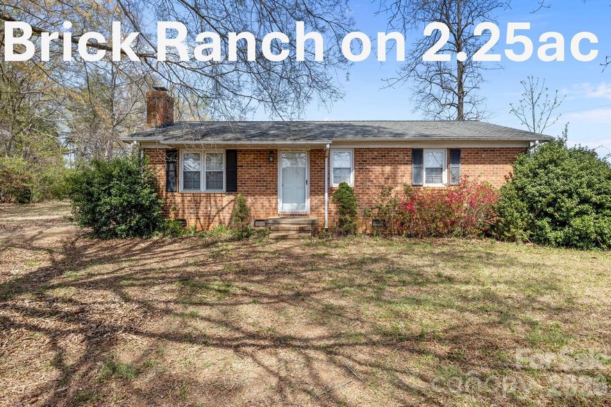 Opportunities like this are few and far between—2.25 acres comprised of two parcels in the heart of Huntersville, offering endless potential for homeowners, investors, and builders alike. Whether you envision restoring the existing home, creating a private estate, or exploring development possibilities, this property delivers flexibility and value in a highly desirable location. Set among large, stately trees, both parcels are relatively flat and offer a beautiful, usable landscape. The larger 1.46-acre parcel features a small brick ranch that has been vacant for approximately two years but could be brought back to life. The home includes 3 bedrooms, 2 bathrooms, a living room, kitchen, and mudroom—ready for renovation or reimagination. A detached two-car garage structure is also on site (though in need of repair) adding additional potential for storage, workshop space, or future improvement.  The adjacent 0.79-acre parcel is fully treed, offering privacy, natural beauty, and additional options. Keep both parcels together for a more expansive homesite or explore selling them separately. There may also be an opportunity to subdivide the combined 2.25 acres into three lots (subject to approval by the Town of Huntersville), making this an attractive prospect for builders or those looking to maximize value. Located in a terrific area close to everything Huntersville has to offer—parks, sports fields, tennis and pickleball courts, recreation facilities, shopping, dining, Lake Norman, and medical care—this property combines space and convenience. Zoned for desirable schools, it’s an ideal setting for a custom home or investment project.  Imagine designing a stunning modern farmhouse, luxury estate, or even multiple homes- creating something truly special in an established and sought-after community.  For sure, this is very unique opportunity to secure land, location, and potential all in one while still being away from traffic of a main road.  Potential to connect to city water/sewer which is just at the corner.  PARADISE CAN EXIST AND YOU JUST MIGHT HAVE FOUND IT