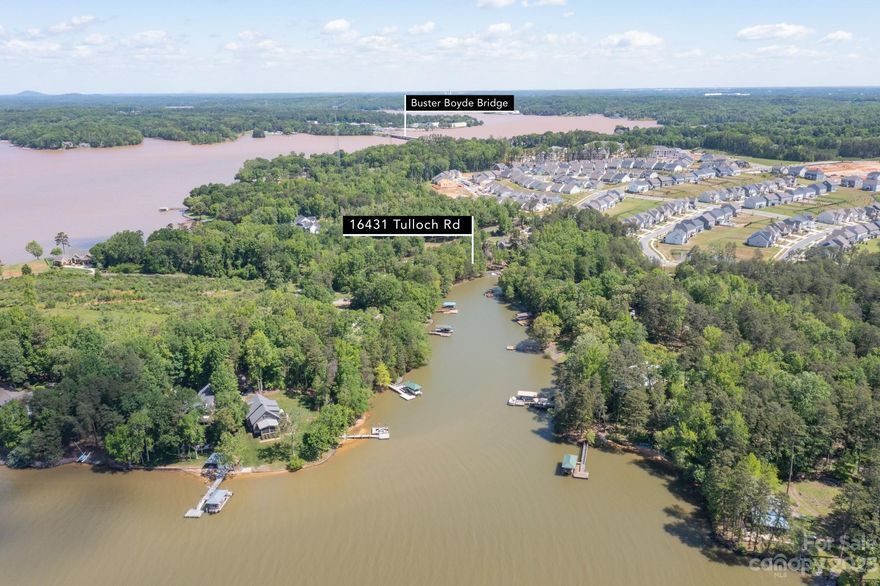 WATERFRONT LOT with boat dock permit in the Palisades. This is a vacant half acre lot, ready to build your waterfront living home with a boat dock! Incorporated into the Palisades but not part of the HOA, grandfathered in. Close to Charlotte and private lake living on one of Charlotte's premier Lake Wylie neighborhoods! Water views, oudoor living at it's finest. Sandy beach area for swimming & relaxing. Floating dock permitted. Pallisades amenities  closeby. Fully fenced with aluminum fencing. No Access gate to the lot yet. Call Pierre Maree the listing agent for access.