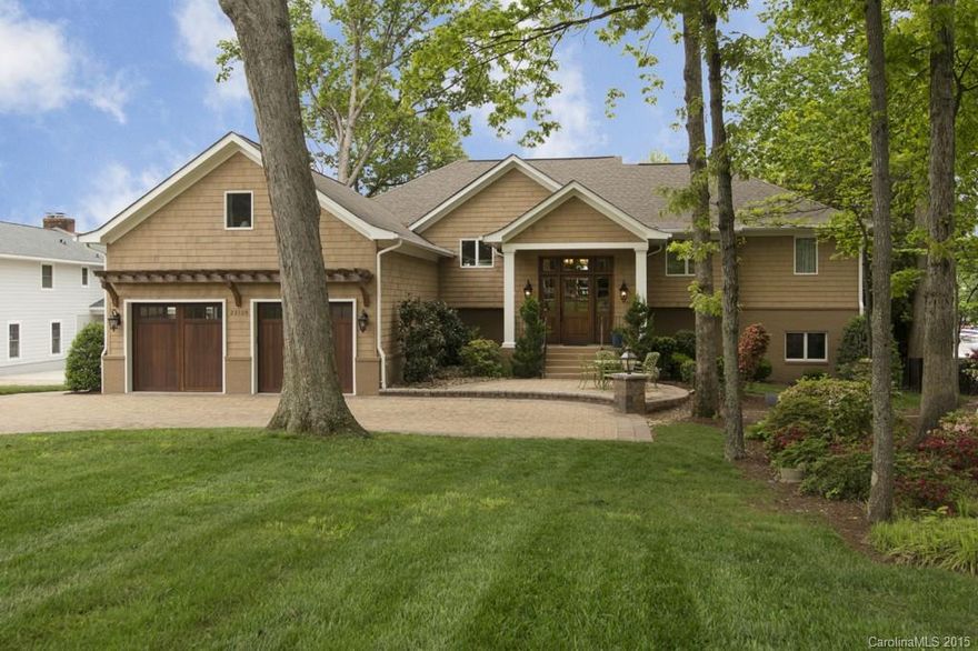 Stunning WATERFRONT home in Cornelius, close to everything!  Recently updated throughout, this gorgeous property features unparalleled living space inside and out! Top of line appliances and custom cabinetry in Gourmet kitchen. No details overlooked. Outdoor living features 2-level covered patio both with slate floors. Chef's outdoor kitchen and stunning views of Lake Norman. Dual boat slip floating dock, w/2-jet ski slips. Large sandy beach for fun all summer long! Beautifully landscaped!
