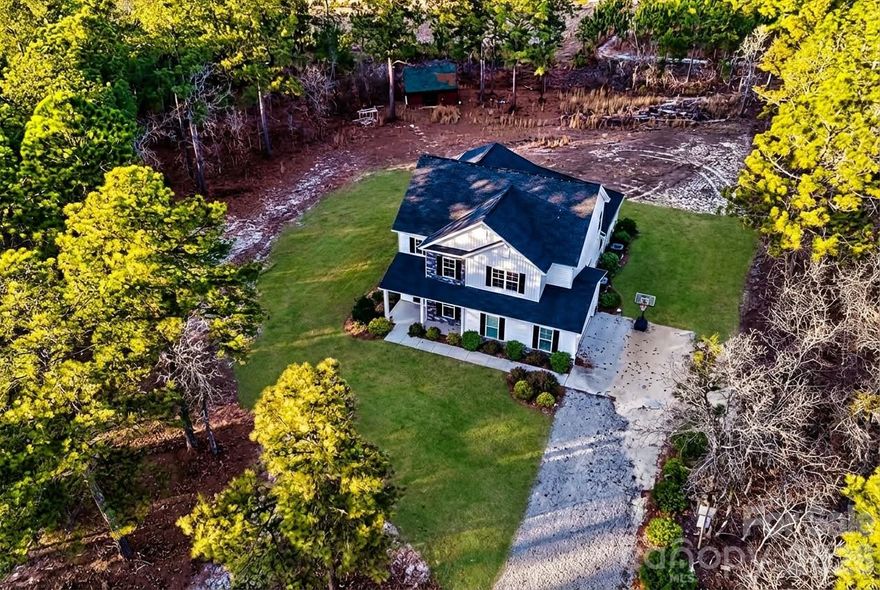 **Stunning 2024 custom build on 1.38 acres in the heart of the Kershaw countryside!** This beautifully designed home offers **3,125 heated square feet and approximately 4,000 total gross square feet**, providing generous living space and a **large attached garage**—perfect for storage, hobbies, or multiple vehicles.  Listed UNDER APPRAISED VALUE! Enjoy the perfect blend of modern luxury and peaceful country living, just 10 minutes from downtown Kershaw, 20 minutes to Camden, and under an hour to Columbia.

The main level features a bright, open-concept layout with luxury LVP flooring, a dedicated office, spacious laundry room, and abundant storage throughout. The chef’s kitchen is the heart of the home, showcasing a large center island, granite countertops, high-end appliances, and a separate dining area ideal for entertaining. The **massive primary suite** is located on the main floor and boasts a spa-inspired ensuite bathroom and a large walk-in closet.

Upstairs, you’ll find a **huge loft** perfect for a second living area, playroom, or media space, along with **four additional bedrooms, two full bathrooms, and walk-in attic storage**.

Zoned for **award-winning and highly rated North Central Schools**, this home sits on a private **1.38-acre lot**, offering space, privacy, and room to breathe while still being conveniently located near town. A rare opportunity to own a **nearly new, upscale home** with thoughtful design, high-end finishes, and country charm—without sacrificing convenience.