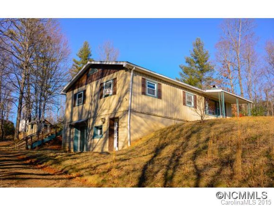 Convenient to I-26, Mars Hill, Weaverville & Asheville, this updated home w/ hidden features is a 4 Bed/2 Bath masquerading as a 3/1. Fully finished 888 sqft basement w/ master suite containing 4th bedroom & 2nd bath not advertised in MLS - 3 BR septic. Open floor-plan w/ master up or down. Island & breakfast-bar in IKEA kitchen. Neat workshop in backyard houses well in foundation. Ample parking & nearly an acre of level-sloping yard to utilize.