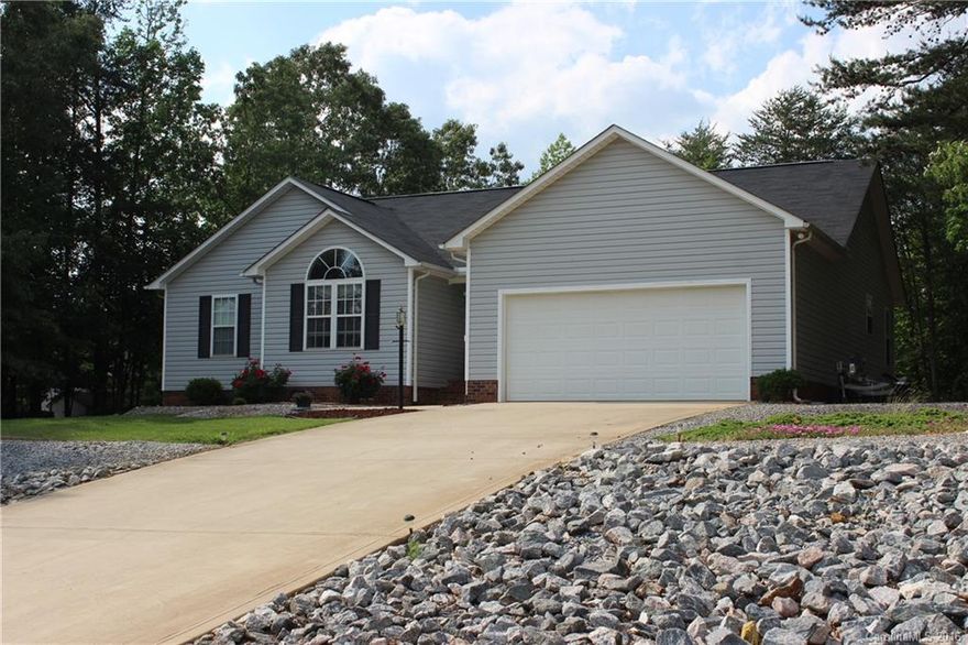 Enjoy this captivating home in desirable North Lincoln. Pre-inspected! Beautifully landscaped front and backyard for the nature lover. Grill on the back deck with herbs from the garden. The kitchen and dining room also have a beautiful view of the backyard. The living room features vaulted ceilings and a fireplace for the winter or open the screen door in the spring.  Bedrooms are nice and roomy. The master bedroom is spacious and sunny with a decorative plant ledge. Don't miss; won't last long!