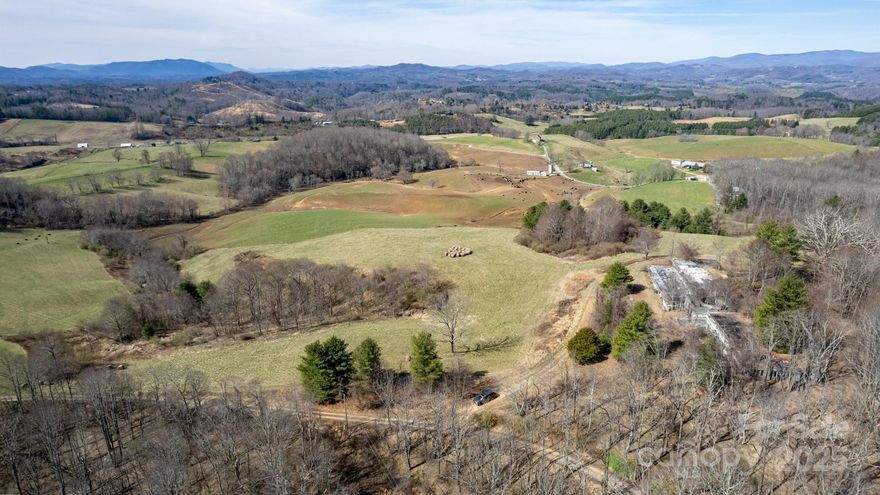 Experience this extraordinary estate property in Alleghany County township of Piney Creek, not far from the New River and Blueridge Pkwy. A sprawling 260 acres of lush pastureland, woodlands, and a large pond. The perfect backdrop for your dream home or vacation rental. Multiple possible building sites with long range views, ATV trails, historic log shed, a hunter's paradise, teeming with deer and turkey. The unique 4 bedroom, 3 bath home, with unlimited potential is included in he package "as is", offering unparallel views of Mt Rogers and surrounding mountains.