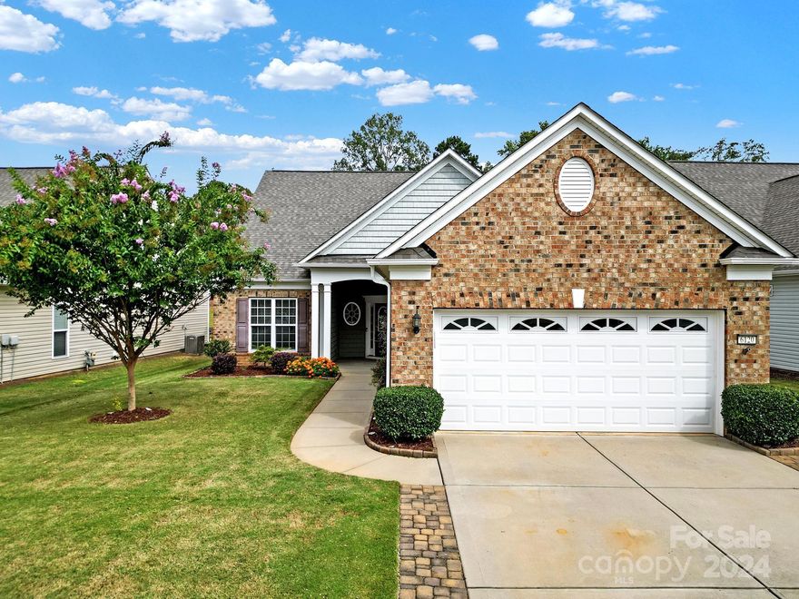 Move-in ready Surrey Crest w/ loft in amenity-rich Sun City! Brand new LVP flooring, carpet, & fresh paint! Upgraded kitchen boasts granite counters, SS appliances, a gas cooktop, wall oven, a large island, & a dining nook! The open concept great room features a gas-log fireplace and flows into the spacious sunroom. A home office w/ French doors is great for a home office, den, or hobby room. The primary suite w/ a tray ceiling has windows overlooking the rear yard and  an en-suite bathroom w/ a glass enclosed shower, dual sink vanity, & walk-in closet. A guest bedroom & hall bath are great for overnight guests. Loft area offers another bed/bath and additional space for a 2nd living area or game room! Enjoy morning coffee while relaxing on the screened porch, and host friends & family on the extended paver patio w/ stone sitting walls! Laundry room has tons of cabinets for extra storage. Extended 2-car garage w/ walk-up attic access & a paver-widened driveway. Come see this home today!