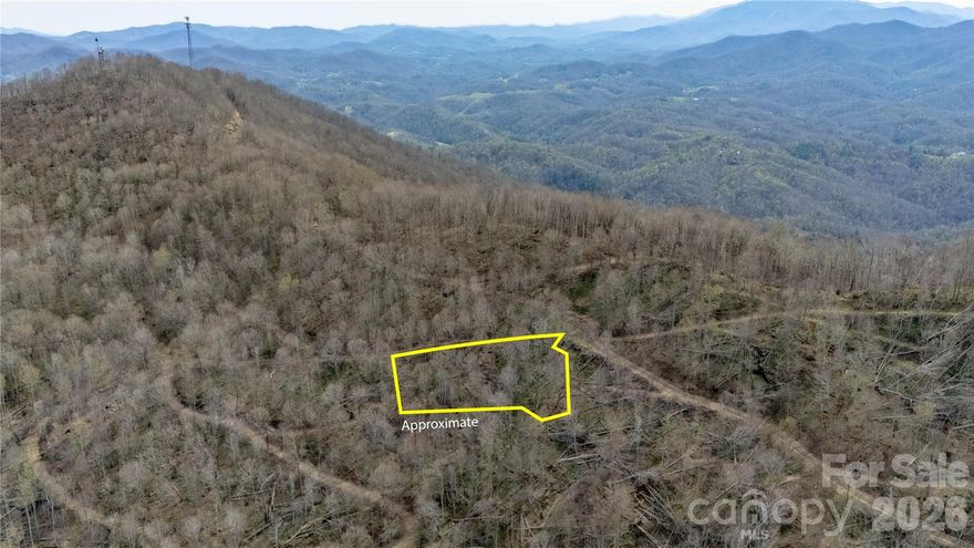 The private gated Bear Ridge community in Bakersville, NC, this beautiful wooded mountain lot offers privacy, natural beauty, and real potential for long-range mountain views with some clearing. This lot would be a great spot for that mountain get-a-way!
Bear Ridge is a quiet, gated community with annual dues of just $250 per lot per year. The minimum home size is 850 square feet—no manufactured or modular homes allowed. Short-term rentals are permitted according to community guidelines. The community features two nice common areas for all owners and guest to enjoy. One sits right along Little Rock Creek (a stocked trout stream) with a picnic shelter—perfect for fishing, wading, relaxing, or just listening to the water. The second is a larger pavilion and gathering space great for family events or community get-togethers.
You'll be surrounded by stunning mountain scenery, waterfalls, hiking trails, state parks, and national forest. Wildlife is plentiful—deer, squirrels, and black bear are commonly seen. Expect cool summers, fresh air, and that true mountain feel. Roan Mountain and several trout streams are close by, and Banner Elk and Sugar Mountain are only about 35 miles away.
The lot is easily accessible via a well-maintained gravel road behind the gated entrance. Electric and internet are available in the community. 
Whether you're looking for a weekend retreat, a full-time mountain home, or an investment property, this lot gives you the perfect mix of seclusion and convenience. You're still within about an hour of Johnson City and Bristol to the north, Asheville to the south, and the Boone/Banner Elk/Blowing Rock area to the east. Lake James is a little over an hour away.
Development restrictions help protect the character and value of the community. Come enjoy the beauty of the mountains in a friendly, low-key gated setting.