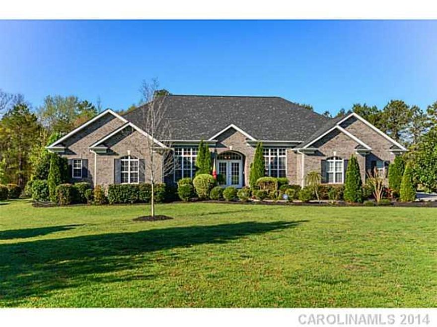 Stunning custom all brick ranch on 1 acre, split bedroom plan. Easy one level living (just 2 short steps up for anyone with bad knees) hardwoods, hi ceilings, open floor plan and more.  The house is completed by a 3 car garage, terrific master suite and screen porch. Country estate living, but just 7 minutes to groceries, 15 minutes  to Ballantyne. Fresh paint, fresh landscaping. Recently inspected,  minimal repairs made and home warranty inc. Only one step up for bad knees!
