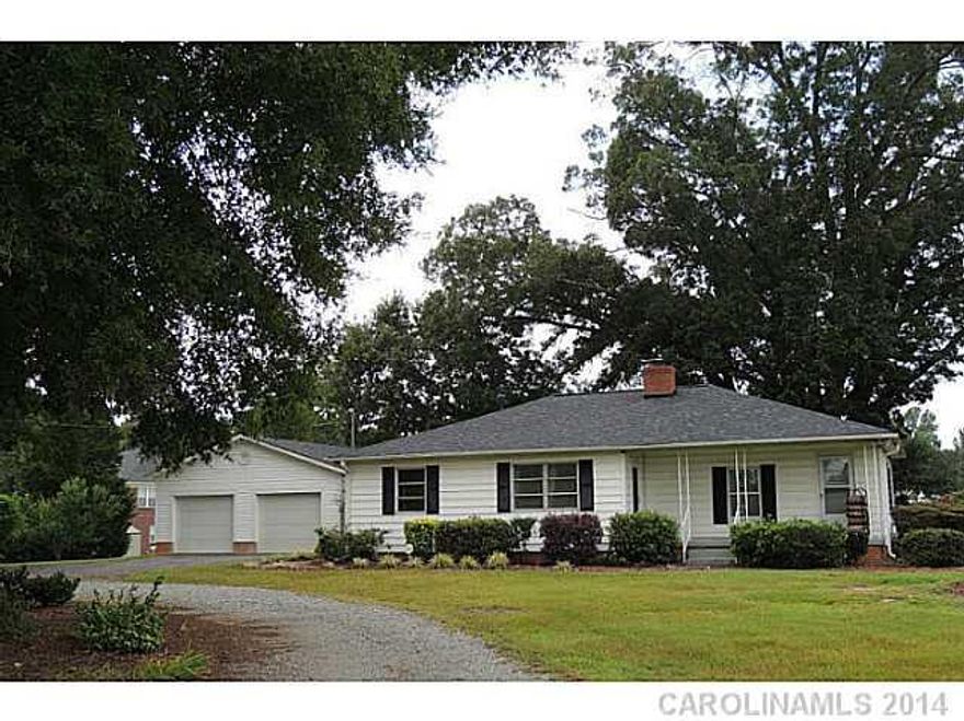 Newly painted and updated farmhouse on 1.2 acres. 26'x36' garage. Hardwoods in living room, tile in kitchen and bath and carpet in all bedrooms. Spacious mudroom at rear entrance. Covered front porch. Woodstove in living room. New roofs on all structures in 2013 and new heat pump in 2013 (per seller).