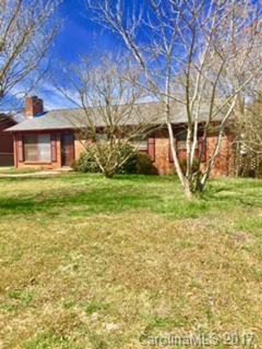 Welcome home! This full brick ranch sits on a FLAT lot with mature landscaping on a quiet residential street.  Roof is only 1 year old. Entire interior just freshly painted. Quite close to shopping centers & Food Lion.  Property is sold as-is.  This one won't last long!