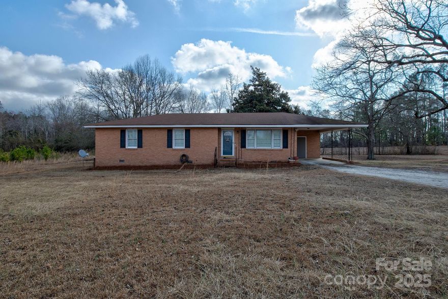 Welcome to 4764 Peach Orchard Road in the up-and-coming town of Pageland, SC.  This charming brick ranch is nestled on a serene 2.77 acre lot in the countryside beside a beautiful creek, adding to it's natural charm- offering both privacy and peaceful surroundings. At 1400 square feet, this home features 3 bedrooms, 1.5 bathrooms, and an attached carport. This home would be perfect for a first-time home buyer, or anyone looking to move out to the country! The home has new windows, flooring, and newly updated bathrooms.  Schedule your showing today!  This one won't last long!