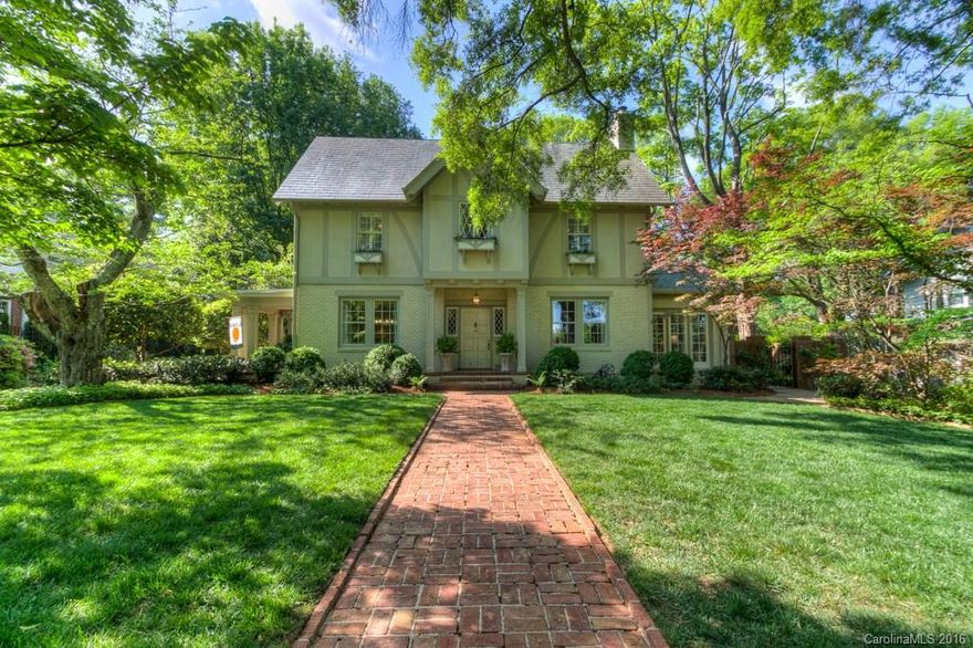 Beautiful 5BR, 3.1BA home in a great Myers Park location.Large half ac. lot, with custom landscaping & John Byrd designed garden-formerly on the Mint Museum Home and Garden tour.Built in 1936. this 3 sty home features open floor plan down,MBR on main,hardwoods throughout, custom cabinets & built ins, butler's pantry, large granite island, gas cooktop,ceramic tile counters,paneled refrigerator,sunroom,wainscoting, slate tile roof, surround sound, fenced in yard, 2 car garage and much, much more.