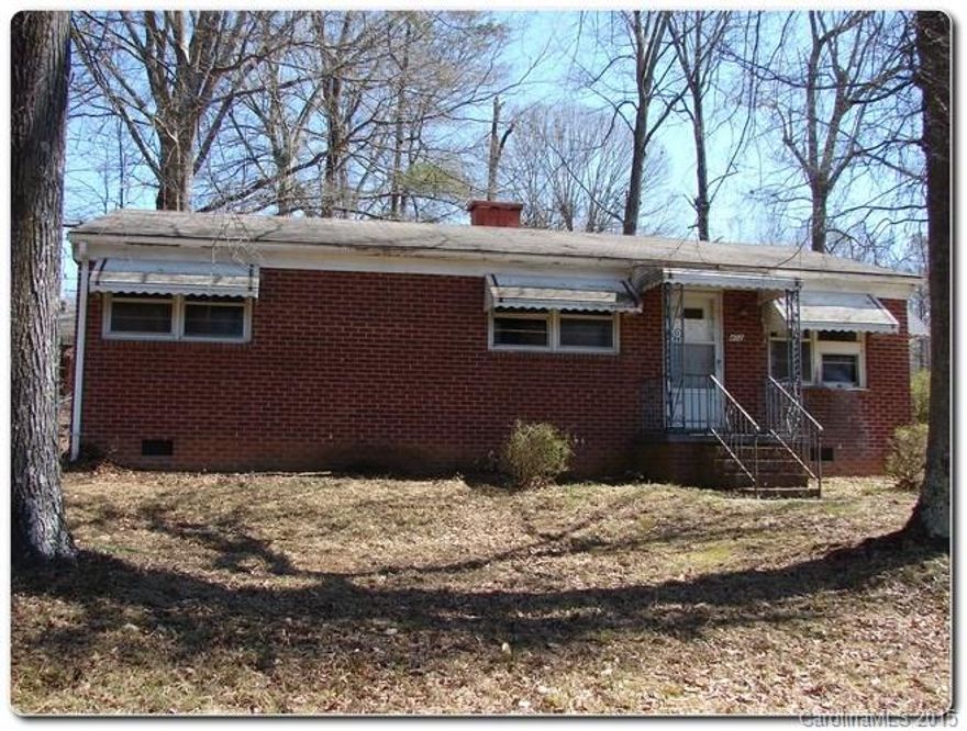 Charming Brick Ranch in Cherryville! Home features open kitchen with large breakfast area! Home offers two covered porches, in the front of the house and on the side. Home has many period details, including wood paneling.