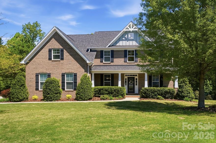 Welcome to your private retreat in the heart of Lake Wylie, South Carolina—where comfort, style, and natural beauty come together seamlessly.

This beautifully maintained 5-bedroom, 4.5-bath home is nestled on a spacious, wooded lot, offering a rare combination of privacy and convenience in a highly sought-after, family-friendly community.

Step inside to a bright two-story foyer with an open staircase, filled with natural light and enhanced by updated flooring throughout the main level. A generously sized main-level suite, ideal as a second primary, office or guest suite, adds flexibility to the floor plan. The gourmet kitchen is designed to impress, featuring granite countertops, a gas range, double ovens, and ample prep space. It opens to a warm and inviting living area with a gas fireplace, creating the perfect setting for both everyday living and entertaining.

Upstairs, the light-filled primary suite offers a vaulted ceiling, expansive walk-in closet, and tranquil treetop and pool views. The second level also features a spacious bonus/game room and three additional bedrooms—one with a private en suite and two connected by a Jack-and-Jill bath.
The true showstopper is the resort-style backyard—your own private oasis designed for relaxation and entertaining, featuring a sparkling pool and spa, screened porch and sun deck, mature landscaping, a fully fenced yard, and a peaceful wooded backdrop. Whether hosting gatherings or unwinding in a quiet setting, this outdoor space truly sets the home apart.

Additional highlights include abundant storage with three linen closets, plus extra space in the crawlspace and attic. The home also features four-sided brick construction and 2x6 framing for enhanced energy efficiency.

Located in the award-winning Clover School District and zoned for the highly anticipated Lake Wylie High School, this home offers access to exceptional education. Enjoy nearby conveniences including a new Harris Teeter, along with neighborhood amenities such as a community pool and clubhouse.

This home offers the perfect blend of space, lifestyle, and location—schedule your showing today!