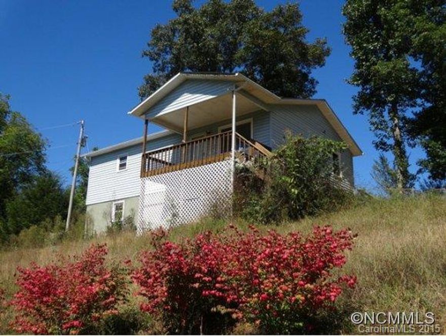 GREAT STARTER HOME, INVESTMENT PROPERTY OR SECOND HOME!! FULL BASEMENT WITH FINISHED BEDROOM, MORE ROOM TO GROW AND DOUBLE GARAGE, FENCED YARD FOR PETS AND OR KIDS, LOCATED JUST OUTSIDE OF TOWN SO IT IS CONVENIENT TO EVERYTHING BUT NO CITY TAXES. EAST ACCESS WITH PAVED ROADS. THERE IS AN HOA FOR COMMUNITY WATER WITH DUES OF $10 PER MONTH THAT IS NOT BEING CHARGED AT THIS TIME FROM INFORMATION THAT HAS NOT BEEN VERIFIED.