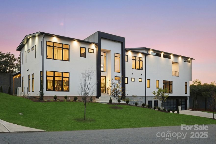 Completed in 2025, this breathtaking 8,010 sq. ft. luxury residence features cutting-edge design, curated finishes, and an amenity-rich floor plan tailored for upscale living in a prime Charlotte location. Set on a 0.3-acre lot near Plaza Midwood, Elizabeth, and Uptown, this six-bedroom home offers expansive living spaces and high-end construction details throughout. The open-concept main level features a striking two-story foyer, a chef’s kitchen with premium Miele appliances, a Sub-Zero wine fridge, Cabico custom cabinetry, and a dramatic granite waterfall island, plus a full scullery for additional prep and storage. The adjoining living and dining areas flow through oversized sliding glass doors to the outdoor patio for truly seamless indoor-outdoor living. A glass-enclosed flex room is ideal for a tasting room or office, while the main level also includes an ensuite guest bedroom and a spacious gym/recreation room. The upper-level hosts three additional guest bedrooms with ensuite bathrooms, a lounge with nano-sliding doors, access to a large patio with skyline views, and a powder room. The primary suite boasts two private balconies, dual custom closets, and a spa-inspired bath with a soaking tub inside the oversized shower suite. The impressive lower level offers a full guest apartment with a bedroom, living room, full bathroom, washer/dryer connection, and mini kitchen. The dedicated theater room is expertly engineered for a true cinematic experience, featuring Dolby Atmos®–ready acoustic design, pre-wiring for full surround sound, specialized screen-optimized wall finishes, and ample space for luxurious seating and immersive entertainment. Additional lower-level spaces include a lounge/bar space, powder room, and mudroom with storage. With triple-pane windows, superior wall foundation, concrete exterior covering, multi-zone climate control, and premium energy-efficient systems, this home delivers luxury, performance, and lifestyle at an unmatched level.