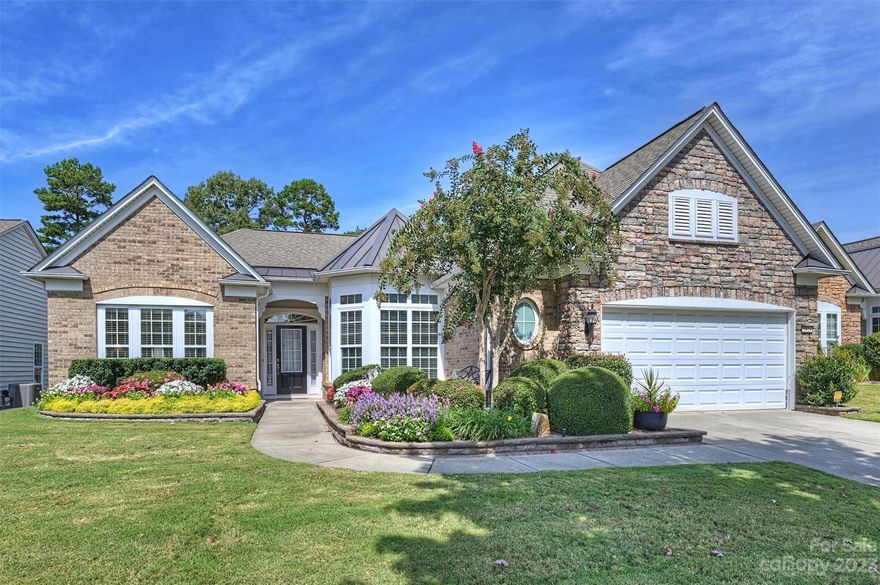 Stunning Cumberland Hall w/Sunroom in sought after Sun City!  Welcome to this immaculate 3 bedroom, 2.5 baths, split floor plan, plus study/den.   New hardwood floors (1/24), including all formal areas, and primary bedroom.  The gourmet kitchen boasts granite, beautiful wood cabinets, stainless steel appliances, wall oven and microwave, pantry and large island plus a breakfast bar.  The open living room has lots of natural light and gas logs in the fireplace for those chilly winter days. The primary suite features large windows, a tray ceiling & ensuite bath w/garden tub, walk-in shower, dual-sink vanity and large walk-in closet.  Two guest bedrooms w/hall access to a full bathroom w/dual vanities. The laundry room offers cabinets and a utility sink.  Enjoy a cup of coffee or an afternoon beverage in the bright and spacious sunroom with the view of a lush, private backyard.  The paver patio is also great for relaxing, or grilling out and enjoying nature.