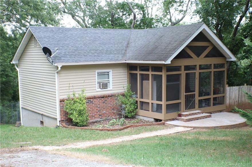 Super convenient location just North of Patton Ave. This 2BR/2BA home is only minutes from Haywood Road and the shops and restaurants of West Asheville. Great for first time home owners or investors. Enjoy sitting on the screened in front porch! Home features hardwood floors, open eat in kitchen, a large fenced in yard and a large fire pit. Roughly 250 sq feet in the basement that is open space for storage/workshop. Lots of charm!