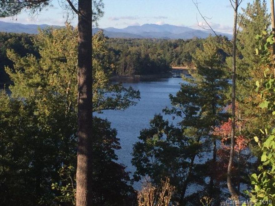 Great lot with incredible long range mountain views of Dobson's Knob, Short Off, Grandmother and Grandfather Mountains. This lot is a dockable waterfront lot with a pre-cleared building pad and septic field already put in!