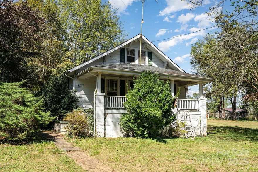 Charming 2-bedroom, 1-bath home nestled on a spacious 1-acre lot in Morganton, NC. Enjoy peaceful outdoor living on the inviting covered front porch or the rear patio—perfect for relaxing or entertaining. Inside, you’ll find a comfortable layout featuring a generous living room, a separate dining area, and a well-appointed kitchen with ample counter space. Additional highlights include a convenient laundry area located near the back entrance, a detached 3 car carport, a storage shed, and expansive front, side, and back yards offering plenty of space for parking, gardening, or play. Walk in cellar with concrete floor with ability to use as workshop. Ideally situated just a short drive from town, this home blends comfort and convenience in a serene setting.