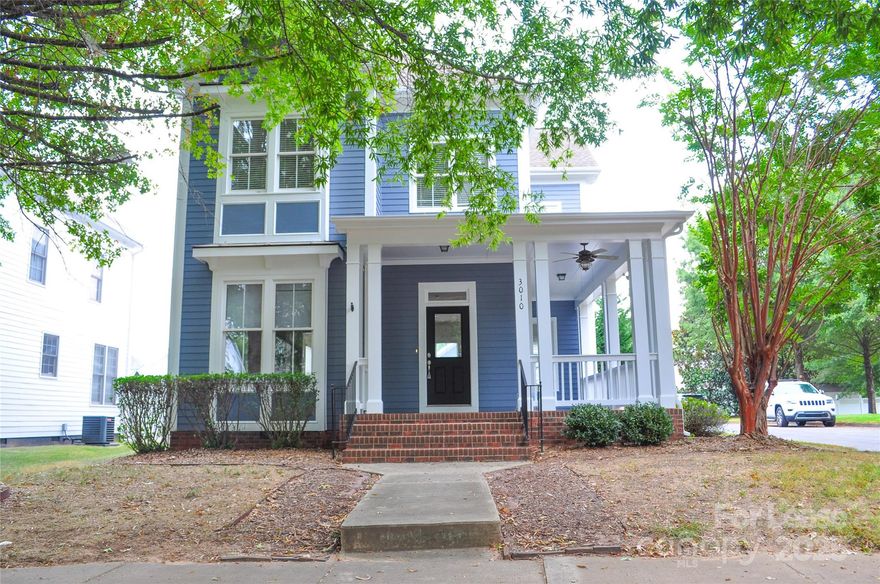 Enjoy the Southern CHARM of this lovely wrap around porch, AND corner lot in Baxter Village! Open floor plan and flowing HARDWOOD floors throughout the main floor, freshly painted interior/exterior.  Bright sun-lit eat-in kitchen with granite countertops, family room with fire place and plenty of windows for natural light, formal dining (or office), and laundry on the first floor (washer and dryer convey).  Spacious upper level opens to a large landing with three bedrooms, two full baths, and PLENTY of storage.  Large, fenced yard with patio and two car detached garage.  Enjoy Baxter Village lifestyle with two pools, tennis courts, parks, community walking trails, shopping, dining, and entertainment.  WALKABLE to the pool, tennis courts, community center, Music in the Park, AND the community town center on Market Street. LAWN CARE INCLUDED IN RENT.  Dogs conditional with non-refundable pet fee and additional deposit. NO CATS. Ready for occupancy. One year OR 10 MONTH lease.