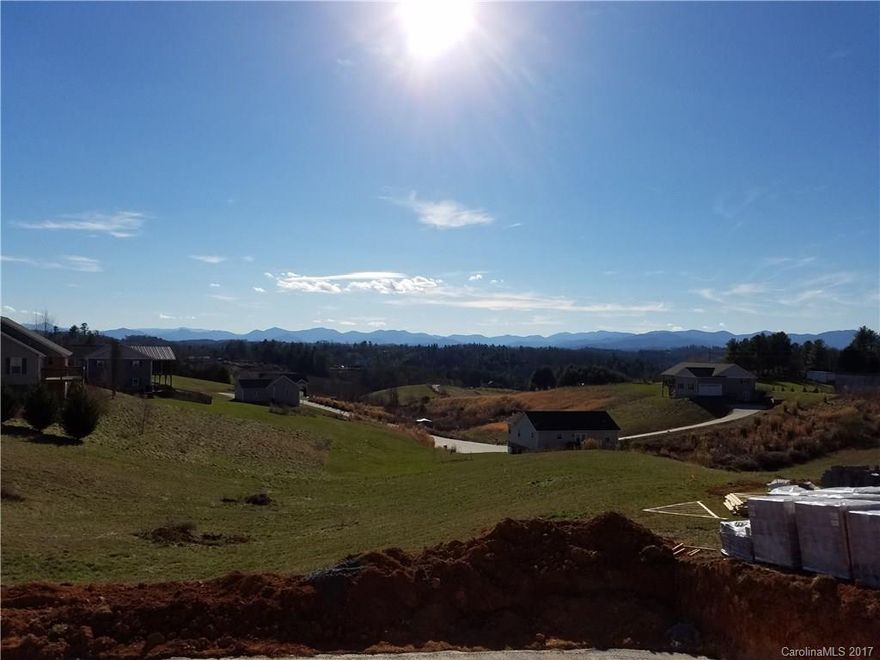 Breathtaking long range views from the pre-construction lot.  This 3 bedroom, 2 bathroom home has an open floor plan, cathedral ceilings, granite counter tops, stainless steel appliances, and a wonderful area for relaxing or entertaining guests on the brand new deck. Make this home yours before construction is finished and get to pick some of your own options. There is another lot option as well.