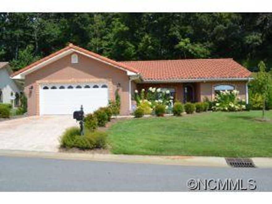 Stunning like new home offered at a great price. 3 bedroom 2baths, roomy master with large master bath and walk in closet. Natural light through out home. Family room with fireplace and opens onto patio. Maple cabinets, stainless steel appliances. Energy efficient . Mountain views in gated community. No steps handicap accessible . $50,000. of updates - Hardwood Floors, Plantation Blinds, Professional Landscaping 10 min. to Downtown Asheville