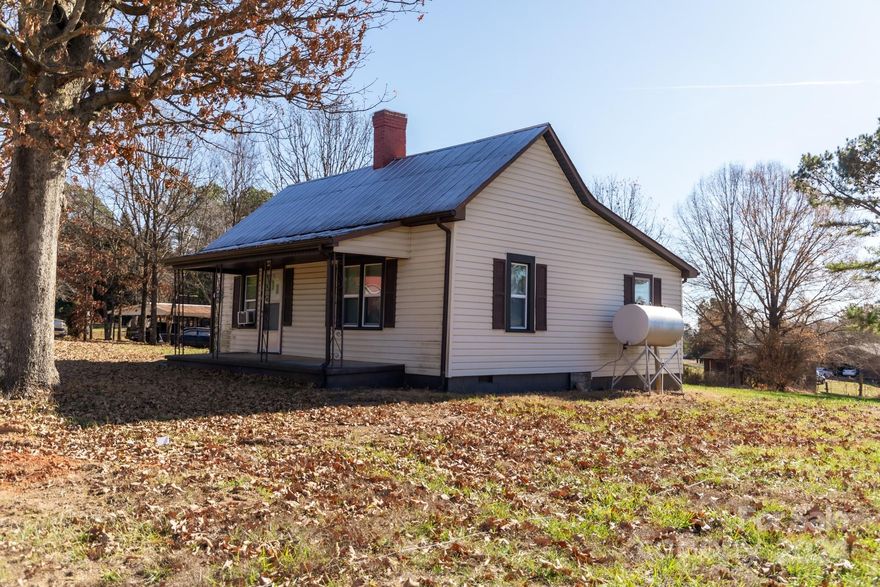 PRICE DROP. This home has history within it's walls.  The original build was  built in 1880, then the addition was built by Harry Gant.  You can't beat the stories  these walls can tell.  Cute cottage 2 bedroom  1 bath on .56 acres newly surveyed.  Could use updating but is livable now.  Tenants just moved out.     This property is waiting on the county to be divided with. 2 other tracks.     IF buyers would like to add the larger home and have the smaller one as a mother-in-law home, pricing will be decided after recorded deeds are made out.    There will be 3 separate listings. The 2 homes and 11.41 acres.   NO septic records found. Estate items sale  is Jan. 31st - Feb 3rd  BRING OFFERS